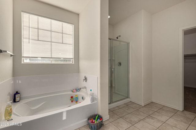 bathroom with tile patterned flooring and independent shower and bath