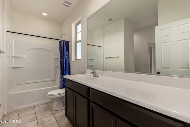 full bathroom featuring tile patterned flooring, vanity, toilet, and shower / bathtub combination with curtain