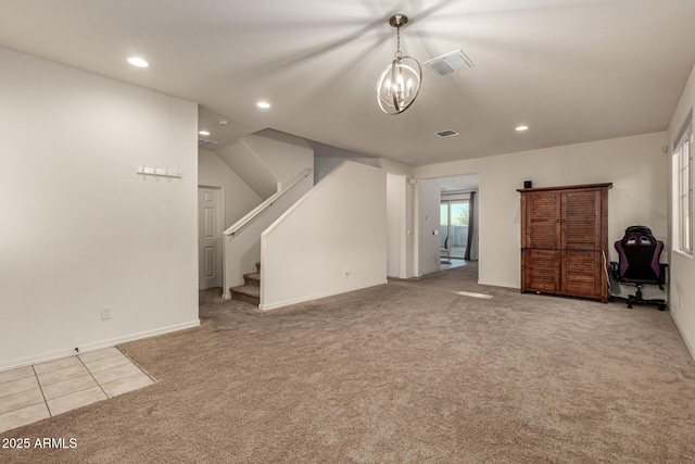 unfurnished living room with light carpet and an inviting chandelier