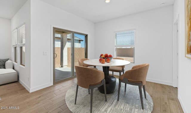 dining area featuring light wood-type flooring