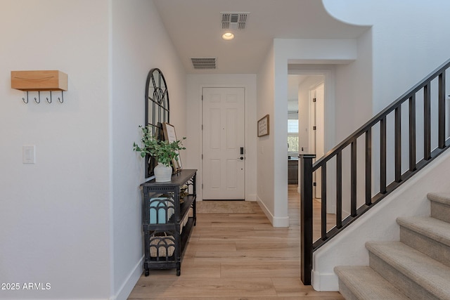 9645 E Ripple Dr, Mesa, AZ 85212 - entrance foyer featuring stairway, light wood-style flooring, and recessed lighting