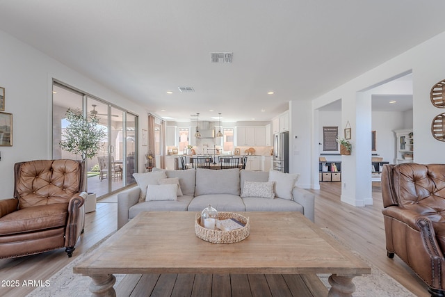 9645 E Ripple Dr, Mesa, AZ 85212 - living room with light wood-style flooring and recessed lighting