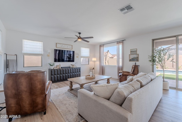 9645 E Ripple Dr, Mesa, AZ 85212 - living area featuring a ceiling fan and light wood-style floors