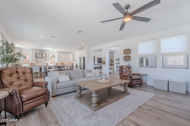 9645 E Ripple Dr, Mesa, AZ 85212 - living room with light wood-type flooring, ceiling fan, and recessed lighting