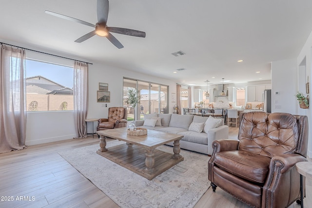 9645 E Ripple Dr, Mesa, AZ 85212 - living room with ceiling fan, light wood-style flooring, and recessed lighting