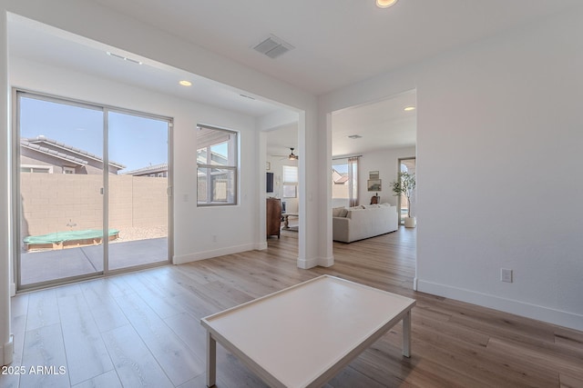9645 E Ripple Dr, Mesa, AZ 85212 - unfurnished living room featuring light wood finished floors, ceiling fan, and recessed lighting