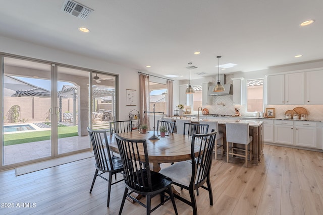 9645 E Ripple Dr, Mesa, AZ 85212 - dining space with healthy amount of natural light, light wood-style flooring, and recessed lighting