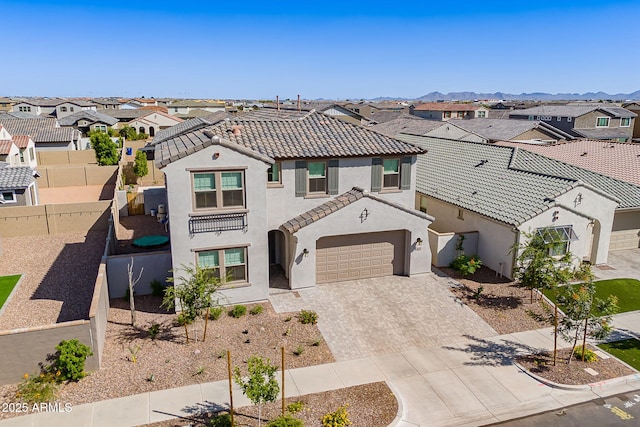 9645 E Ripple Dr, Mesa, AZ 85212 - mediterranean / spanish home featuring a residential view, stucco siding, decorative driveway, and a tiled roof