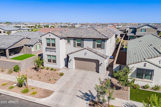 9645 E Ripple Dr, Mesa, AZ 85212 - view of front of home featuring a residential view, decorative driveway, stucco siding, a tile roof, and an attached garage