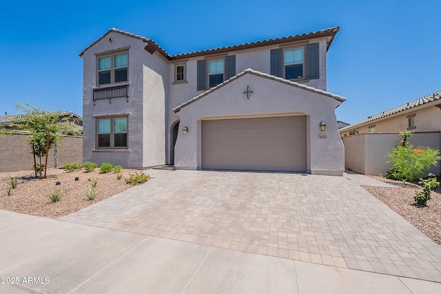 9645 E Ripple Dr, Mesa, AZ 85212 - mediterranean / spanish house with stucco siding, decorative driveway, a tiled roof, and an attached garage