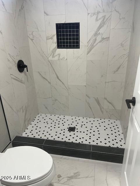 full bath featuring toilet, visible vents, a shower stall, and marble finish floor