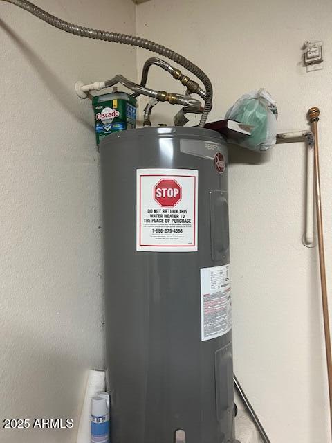 utility room with water heater