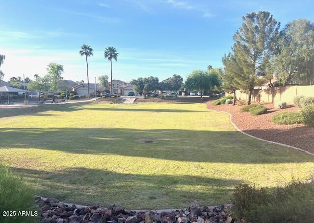 view of home's community featuring a lawn