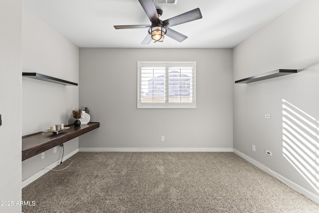 unfurnished room featuring ceiling fan and carpet flooring