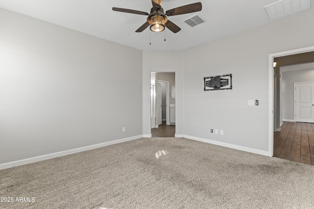 carpeted spare room featuring ceiling fan