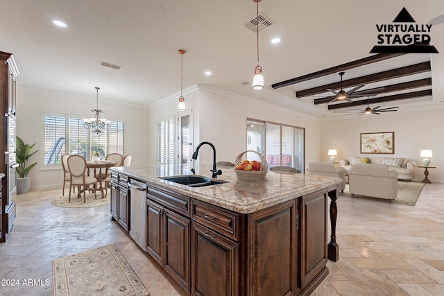 kitchen with light stone counters, a center island with sink, crown molding, hanging light fixtures, and sink