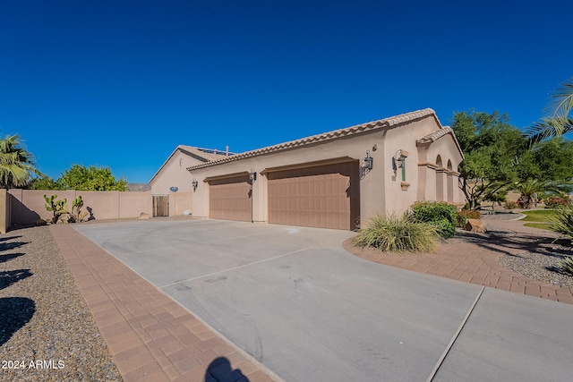 view of side of property with a garage