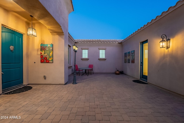 view of patio terrace at dusk