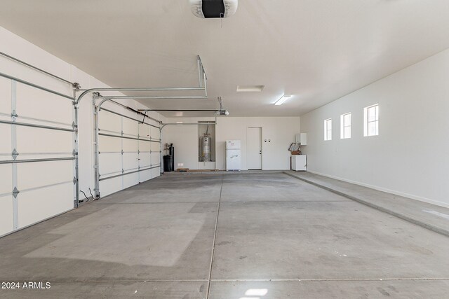 garage featuring gas water heater and a garage door opener