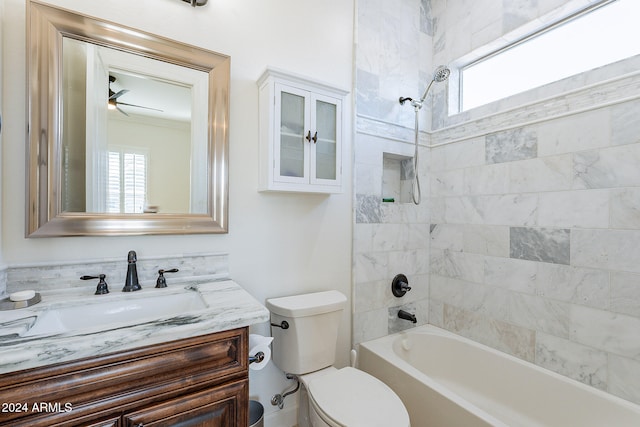 full bathroom featuring vanity, toilet, and tiled shower / bath combo