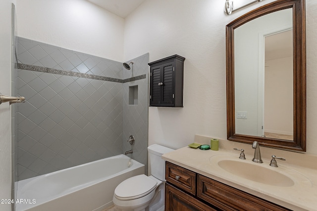 full bathroom featuring vanity, toilet, and tiled shower / bath combo