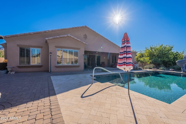 view of swimming pool featuring a patio area