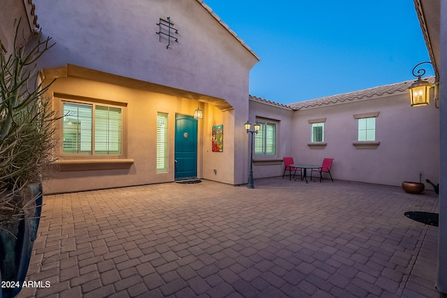 back of house with a patio area