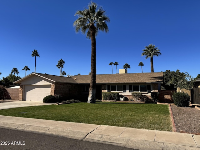 single story home with an attached garage, driveway, a front lawn, and fence