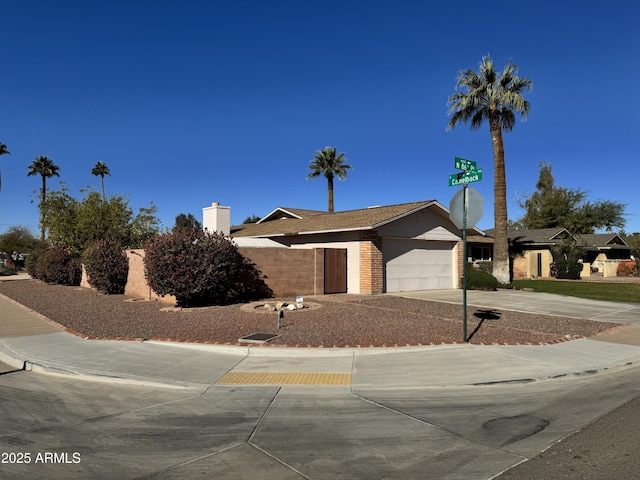 ranch-style home featuring a garage