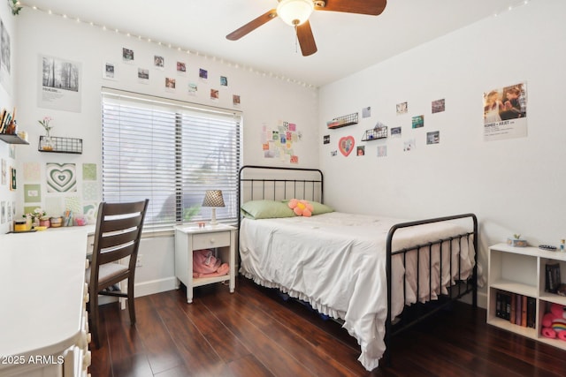 bedroom with dark hardwood / wood-style floors and ceiling fan