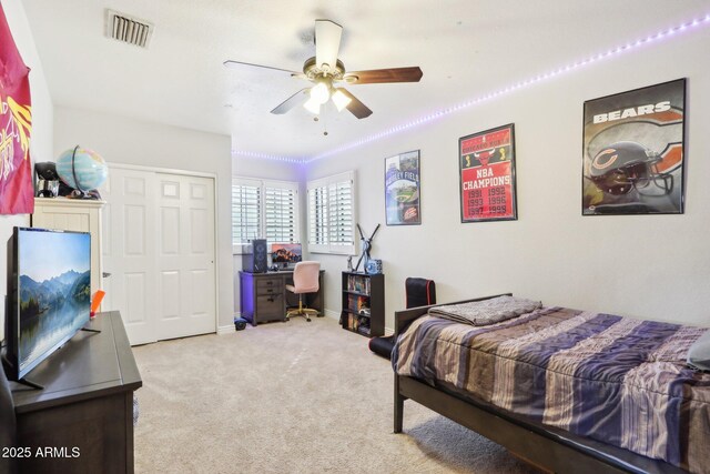 bedroom featuring light carpet and ceiling fan