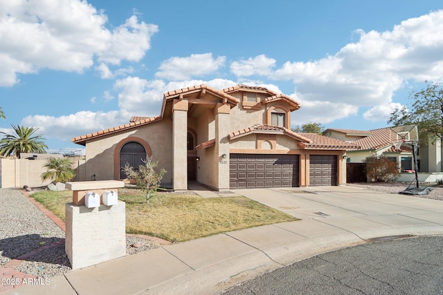 mediterranean / spanish-style home with a garage