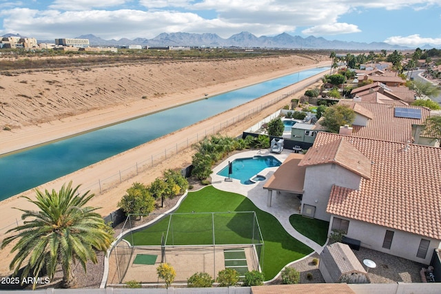 birds eye view of property featuring a water and mountain view