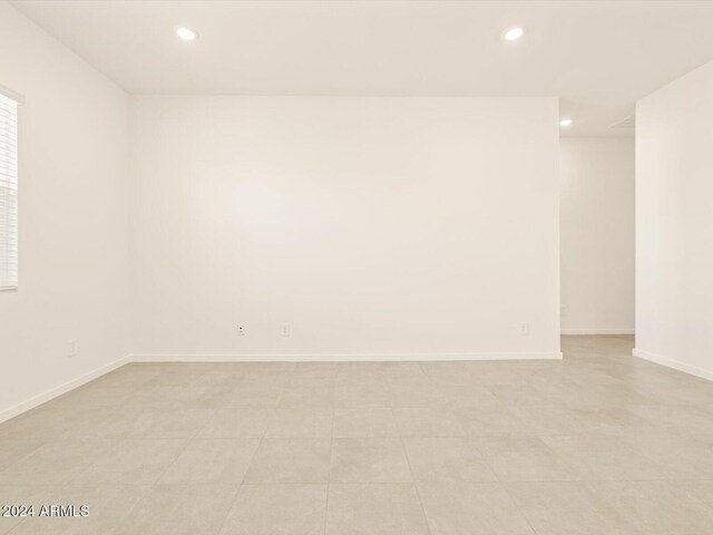 empty room with light tile patterned flooring