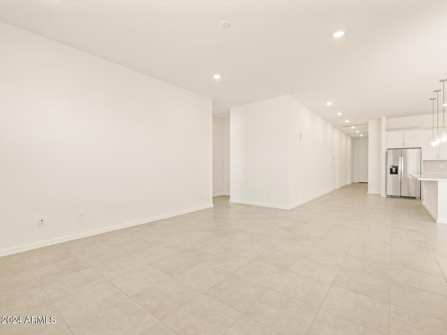 spare room with light tile patterned floors