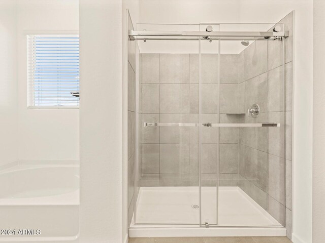 bathroom with independent shower and bath