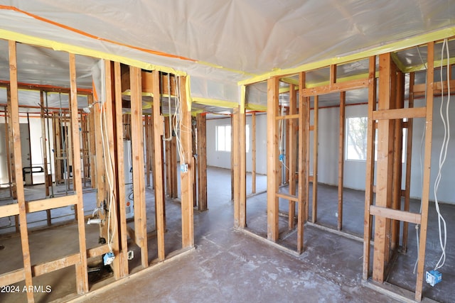 miscellaneous room featuring gas water heater and a wealth of natural light