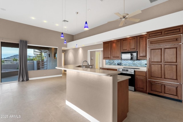 16814 N Boulder Dr, Fountain Hills, AZ 85268 - kitchen with stainless steel range with electric cooktop, black microwave, light countertops, paneled fridge, and a high ceiling