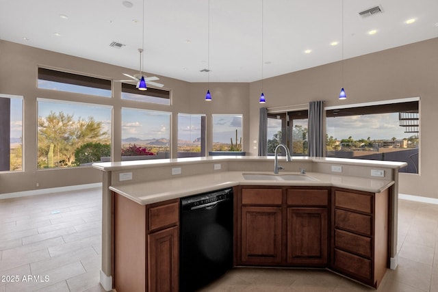 16814 N Boulder Dr, Fountain Hills, AZ 85268 - kitchen with black dishwasher, a sink, light countertops, light tile patterned flooring, and baseboards