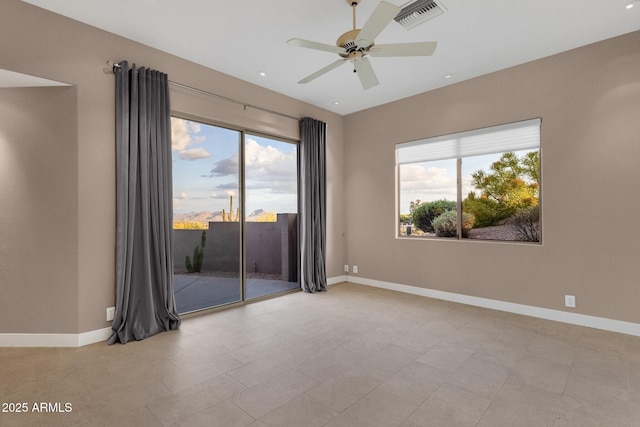 16814 N Boulder Dr, Fountain Hills, AZ 85268 - empty room with healthy amount of natural light, baseboards, ceiling fan, and recessed lighting