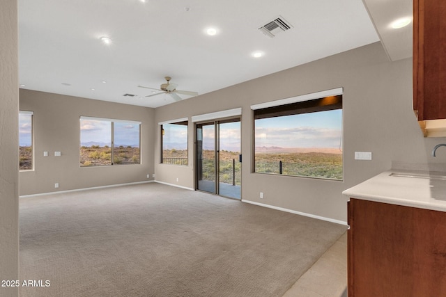 16814 N Boulder Dr, Fountain Hills, AZ 85268 - unfurnished living room featuring a sink, ceiling fan, baseboards, light colored carpet, and recessed lighting
