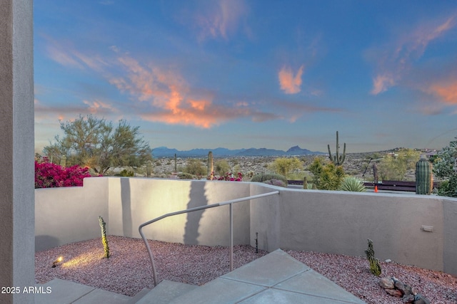 16814 N Boulder Dr, Fountain Hills, AZ 85268 - patio terrace at dusk with a mountain view and fence