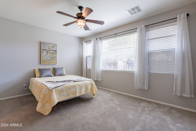 bedroom with ceiling fan and carpet