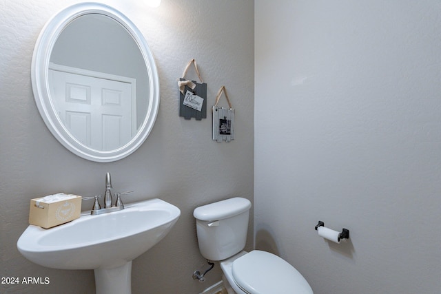 bathroom featuring sink and toilet