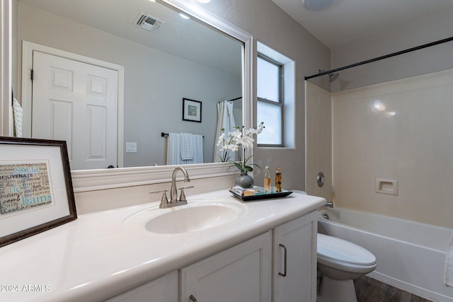 full bathroom with wood-type flooring, vanity, shower / bath combo with shower curtain, and toilet