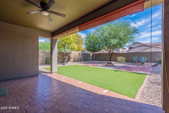 view of patio featuring ceiling fan