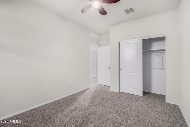 unfurnished bedroom with carpet flooring, a closet, and ceiling fan