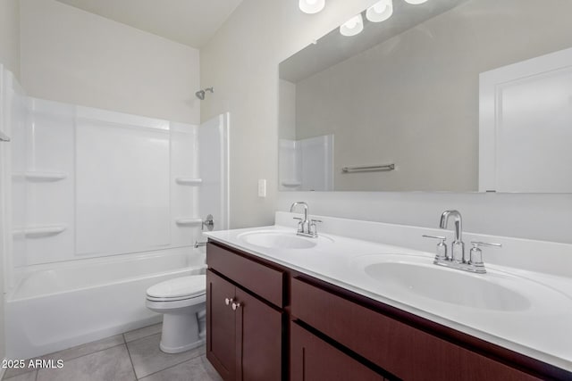 full bathroom with bathing tub / shower combination, vanity, tile patterned floors, and toilet