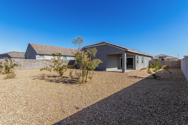 back of property with a patio area