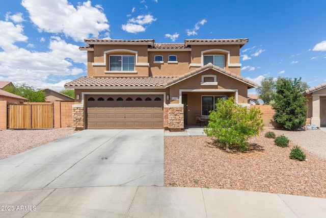 mediterranean / spanish-style home featuring a garage, fence, stucco siding, a tiled roof, and driveway